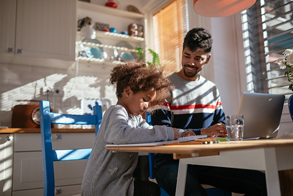 father with child at table